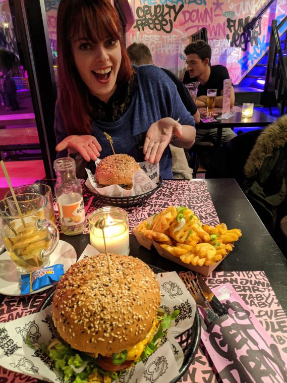 Yuna at Vegan Junkfood Bar with vegan burgers
